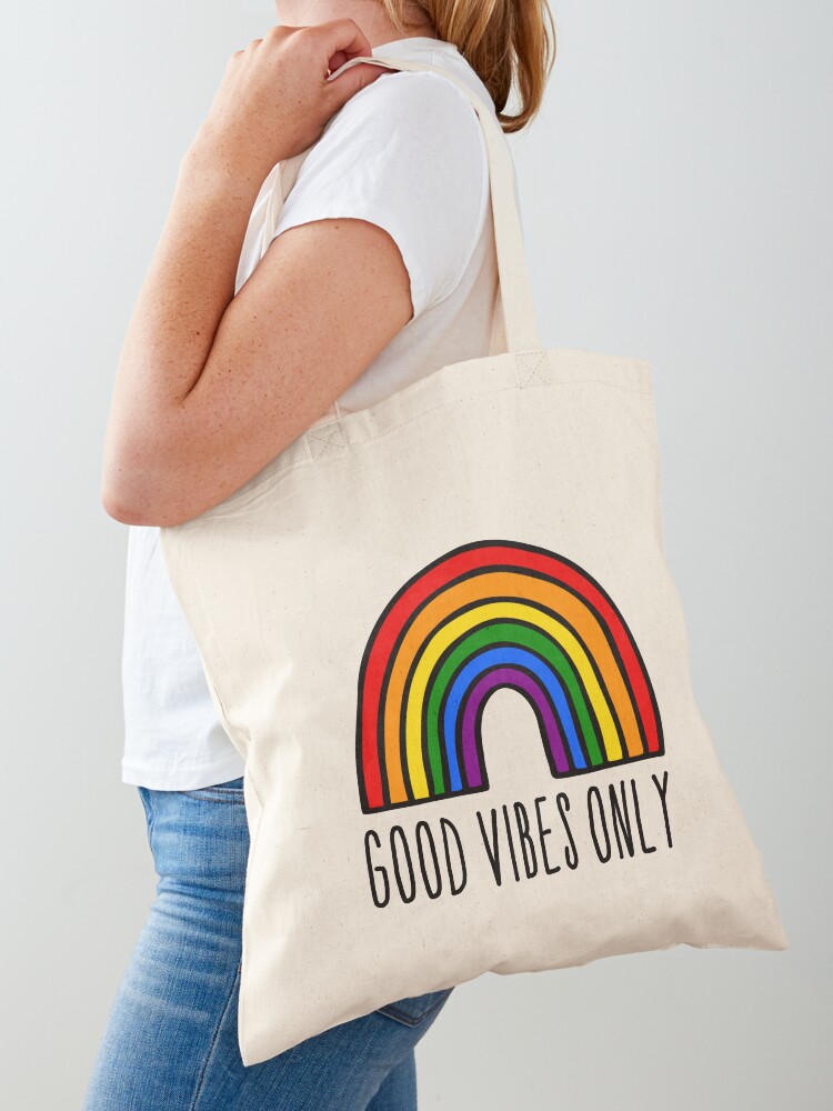 Premium Photo  Peace love pride text rainbow reusable bag against
