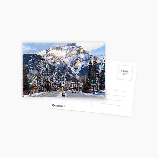 View of downtown Banff National Park, a Unesco World Heritage Site, during the winter. Cascade Mountain in background Postcard