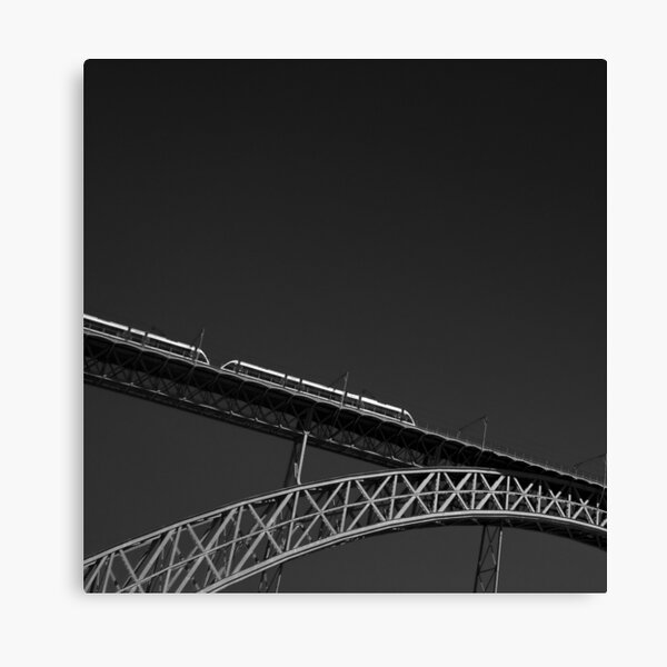 A metro riding across the Douro river on the Dom Luís I Bridge, in Porto, Portugal Canvas Print