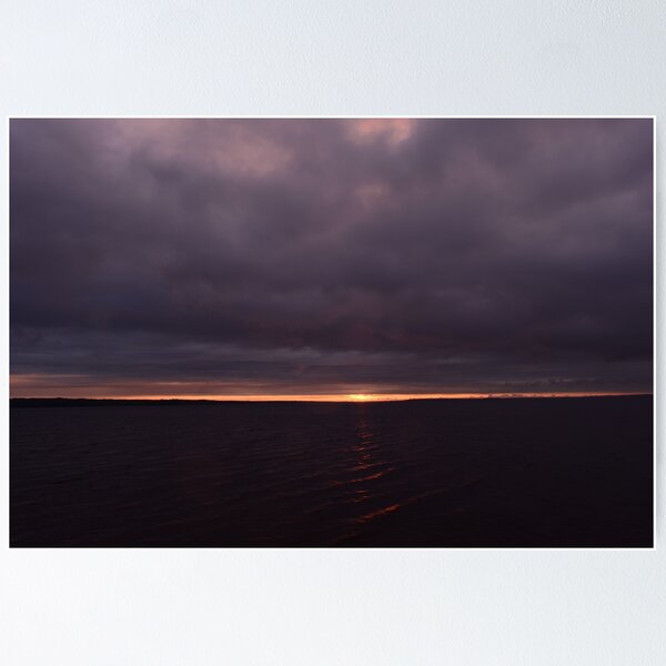 Item preview, Sunbeam from thunderclouds at sunset on a dark surface of the water designed and sold by yarvin13.