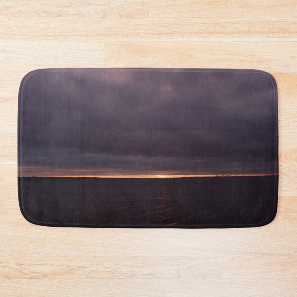 Item preview, Sunbeam from thunderclouds at sunset on a dark surface of the water designed and sold by yarvin13.