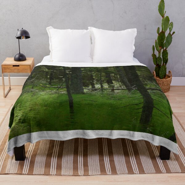 Item preview, Wetland of coniferous forest in thickets of green horsetail with fallen trunks of dry fir trees in the light of the morning sun designed and sold by yarvin13.