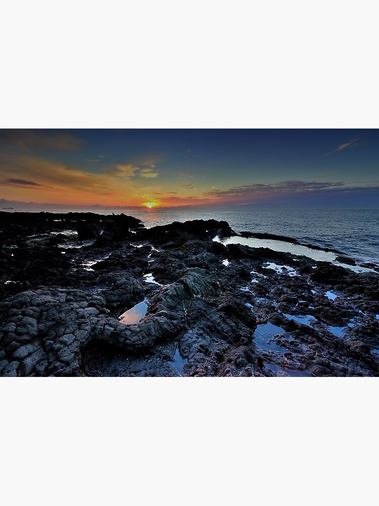 Sunrise with rocks by rapis60
