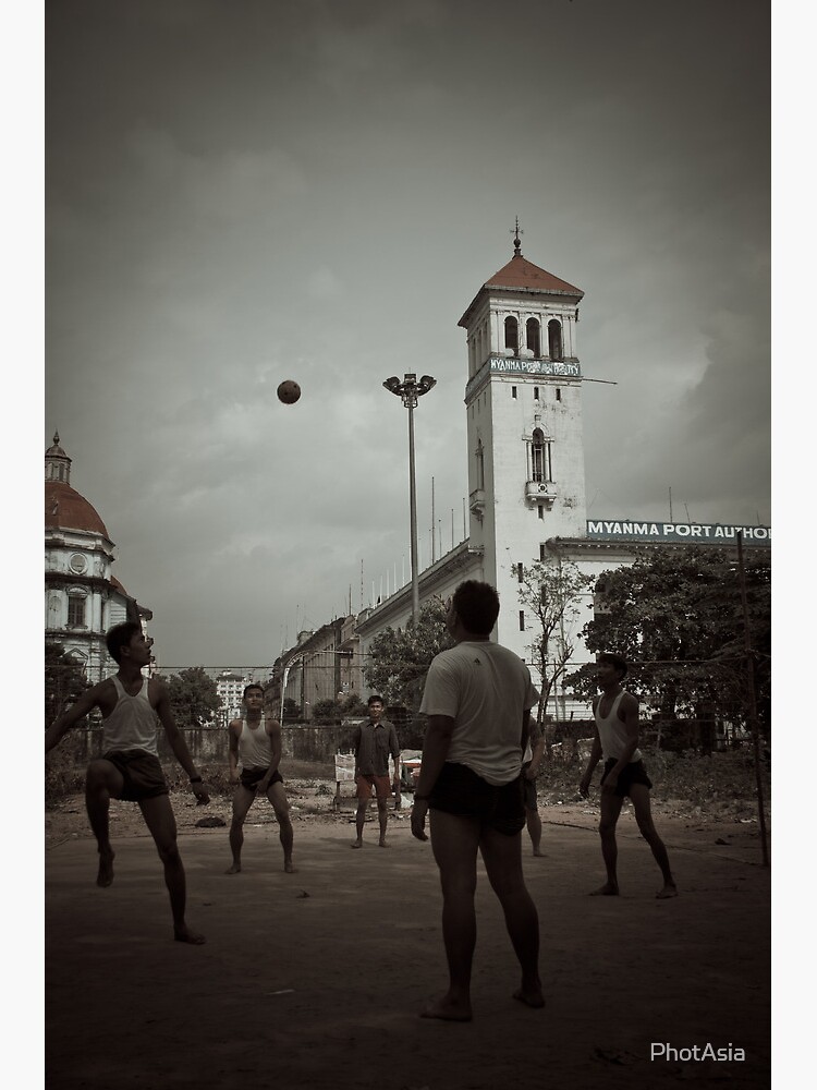 Playing chinlone in Yangon by PhotAsia