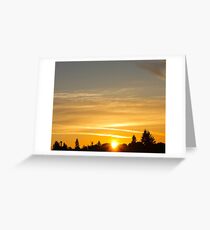 Golden sunset streaked by jet streams Greeting Card