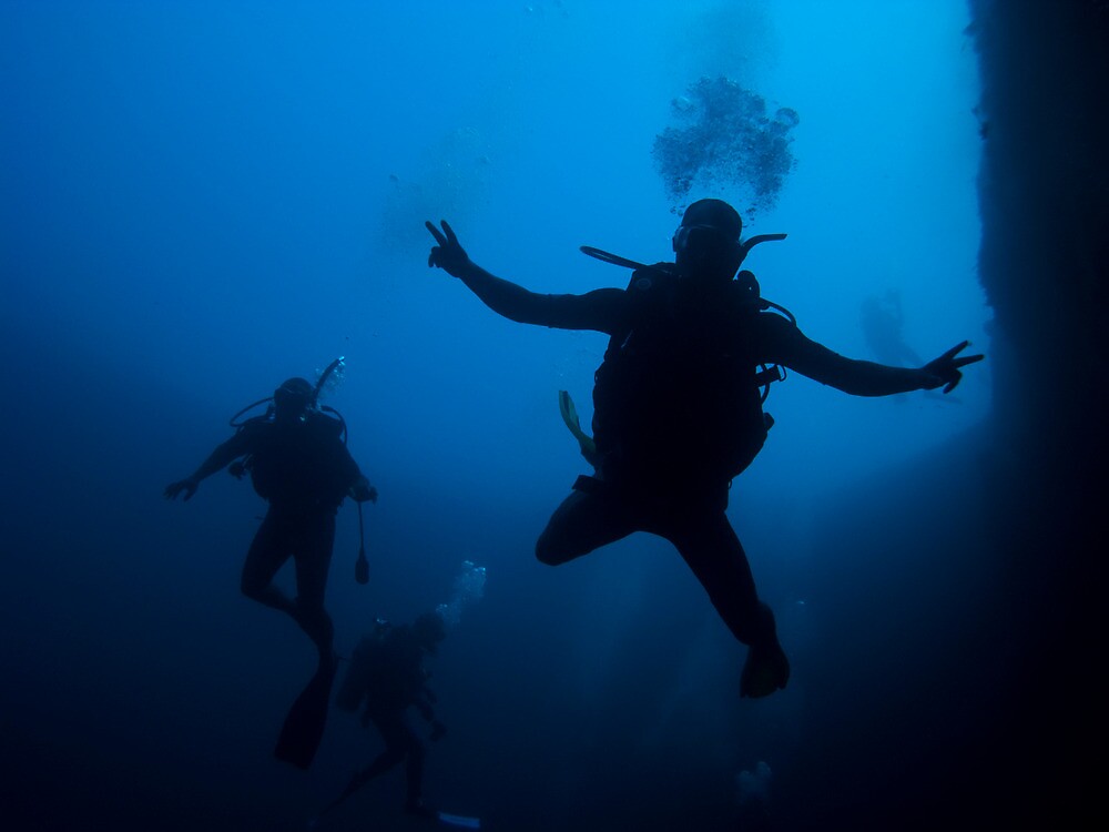 "Scuba Divers in Lost Blue Hole, Nassau, Bahamas" by Shane Pinder