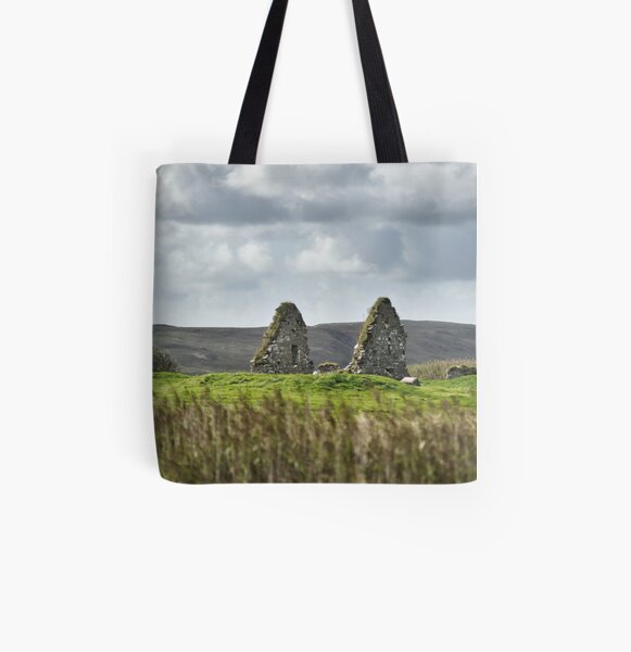 The ruins of Finlaggan seen of the reeds of Loch Finlaggan - Islay All Over Print Tote Bag