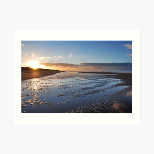 A winter sunset on the beach Art Print