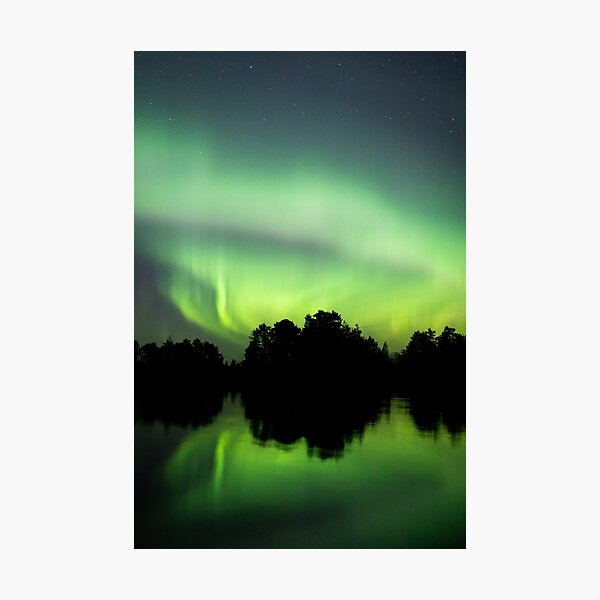 Northern lights glowing over lake in Finland Photographic Print
