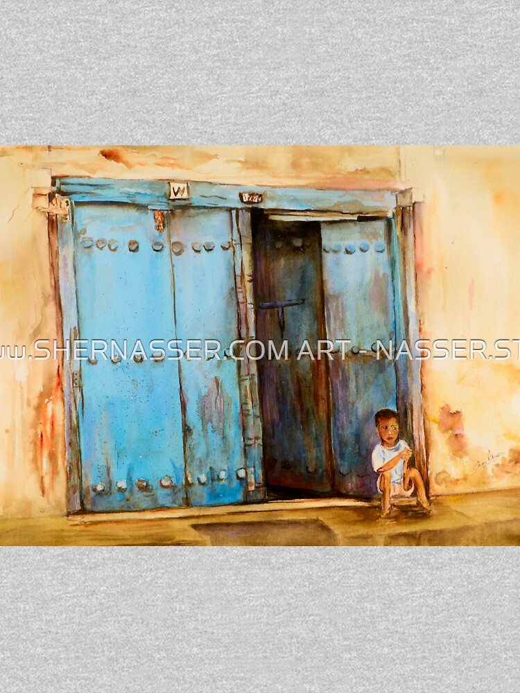 Child sitting in old Zanzibar doorway by shernasser
