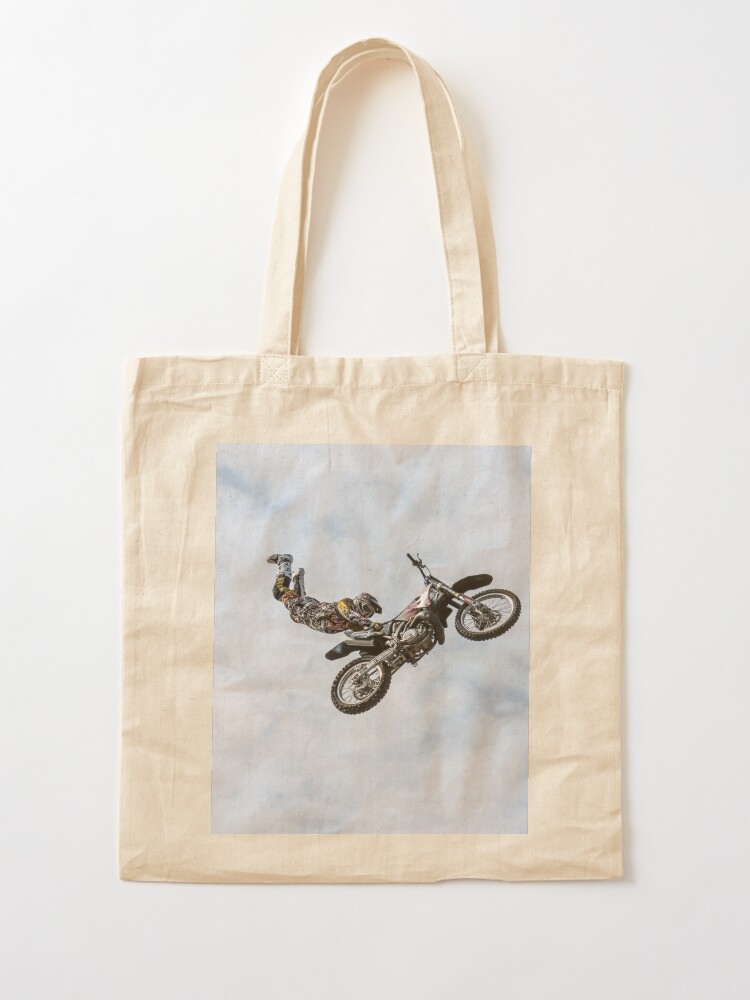 Alternate view of stuntman on a motor cycle jumps Tote Bag