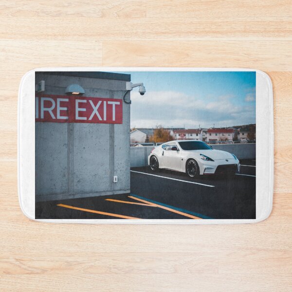 Item preview, white Nissan Nismo 370z parked on roof designed and sold by erikallen920.