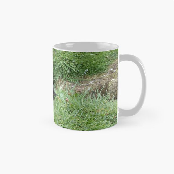 Item preview, Scottish puffin outside burrow designed and sold by Theconkertree.