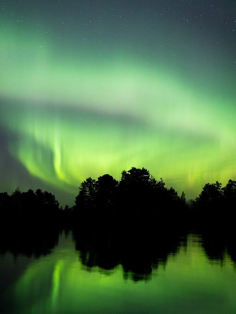 Northern lights glowing over lake in Finland by Juhku