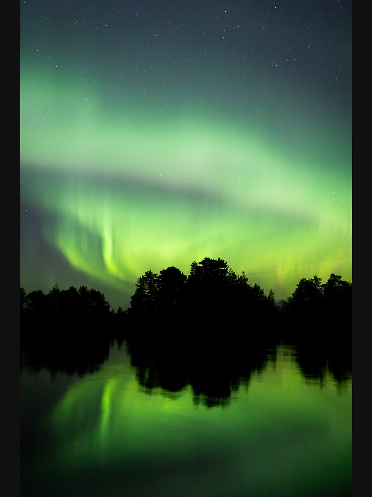 Northern lights glowing over lake in Finland by Juhku
