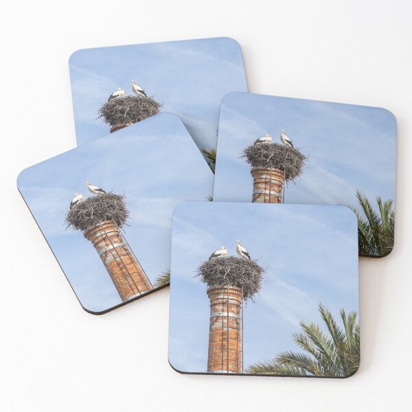 Item preview, Bringing Babies - White Storks Nesting on a Tall Brick Chimney Above the Treetops designed and sold by Georgia Mizuleva.