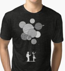 Between planets and balloons. Tri-blend T-Shirt