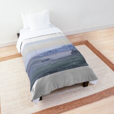 A cow in a foggy field Comforter