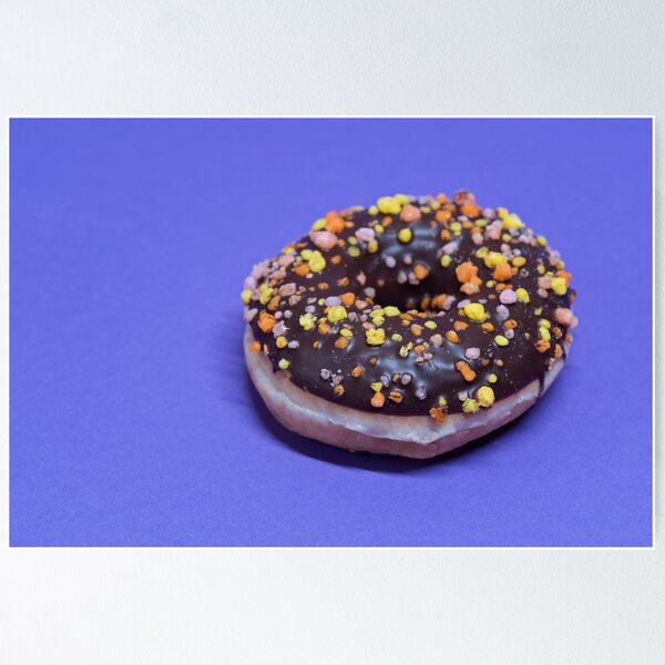 Item preview, Macro shoot of donut on blue background designed and sold by anytka.