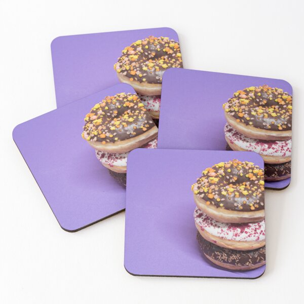 Item preview, Macro shot of stack of donuts over blue background designed and sold by anytka.