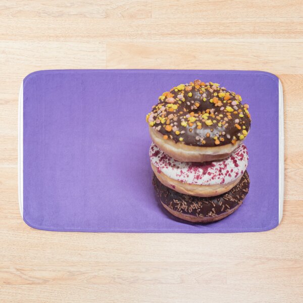 Item preview, Macro shot of stack of donuts over blue background designed and sold by anytka.