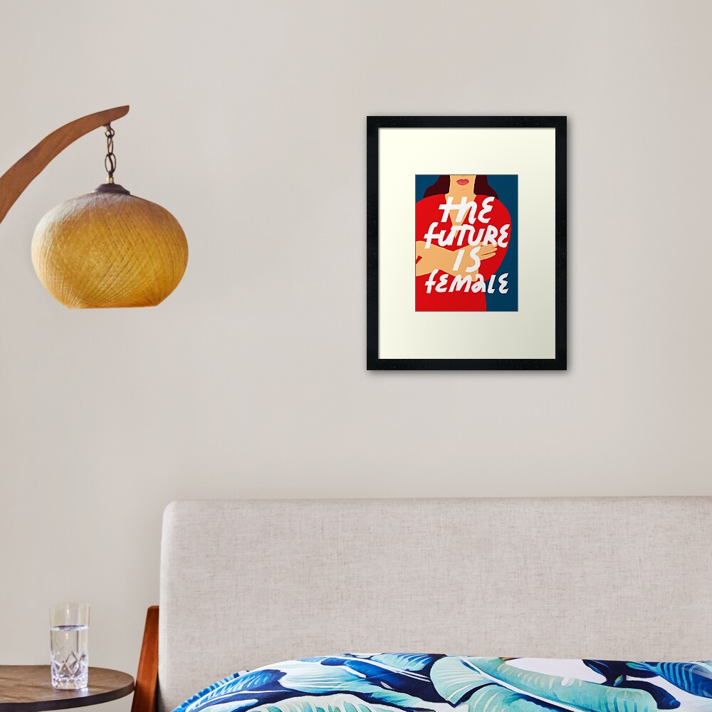 Feminist lettering. Simple inscription for women's right. The Future Is Female inspirational quote. Background with woman's figure in red dress. Framed Art Print