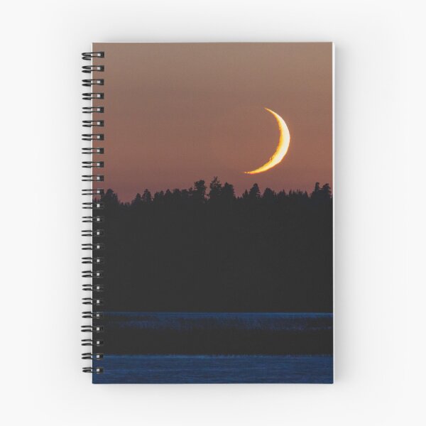 Item preview, Crescent moon setting behind forest landscape designed and sold by Juhku.