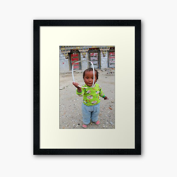 Tibetan girl Framed Art Print