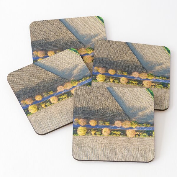 Item preview, Aerial view of country road, autumn trees and ploughed field designed and sold by Lukasz Szczepanski.