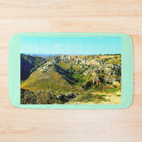 Item preview, Rocky canyon partly covered with green grass and randomly placed shrubs near Matera designed and sold by Kristina Drozd.