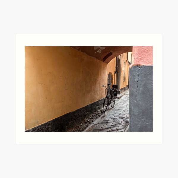 in a narrow alley you see a bike Art Print