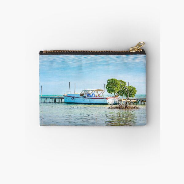 Item preview, A boat at a pier on Caye Caulker in Belize designed and sold by MichielTon.